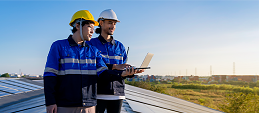 Solar panel technicians conducting monitoring and maintenance tasks
