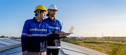 Solar system technicians performing monitoring and maintenance tasks