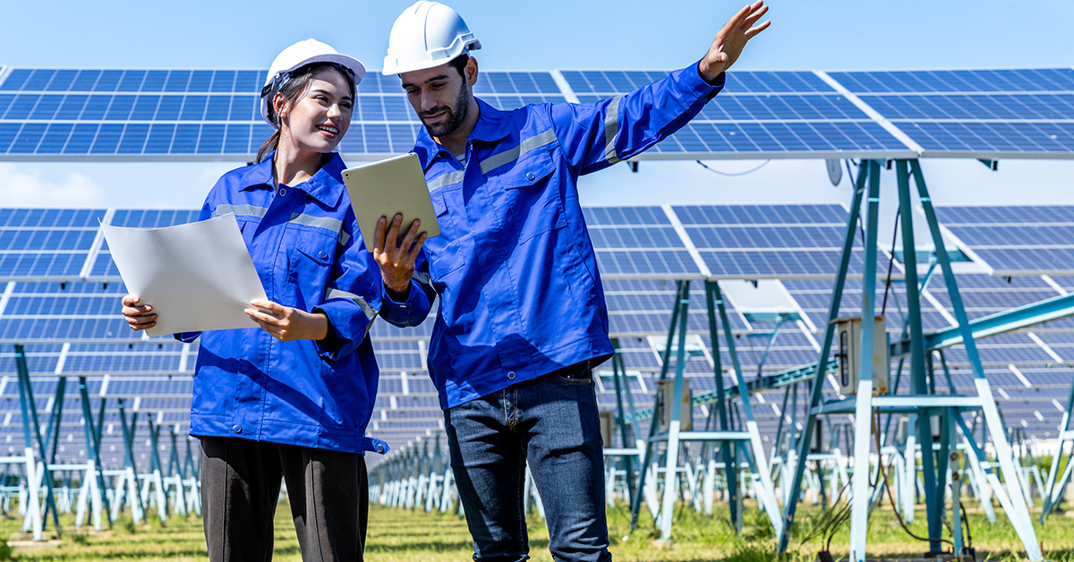 Professional technicians overseeing solar panels